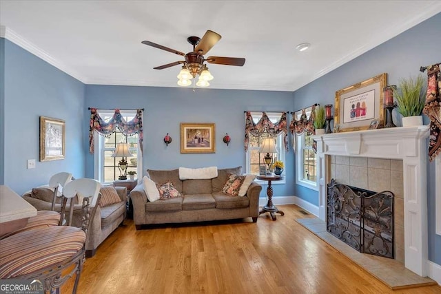 16 Quarter Horse Dr NW, Rome, GA 30165 - living room with a tile fireplace, wood finished floors, crown molding, and ceiling fan