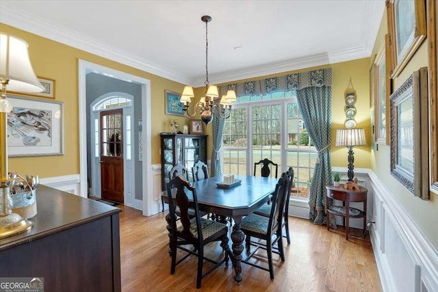 16 Quarter Horse Dr NW, Rome, GA 30165 - dining room featuring light wood finished floors, ornamental molding, a notable chandelier, and wainscoting
