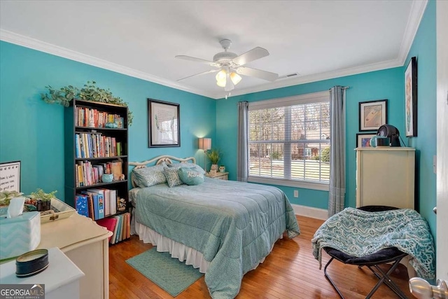 16 Quarter Horse Dr NW, Rome, GA 30165 - bedroom with wood finished floors, visible vents, crown molding, and baseboards