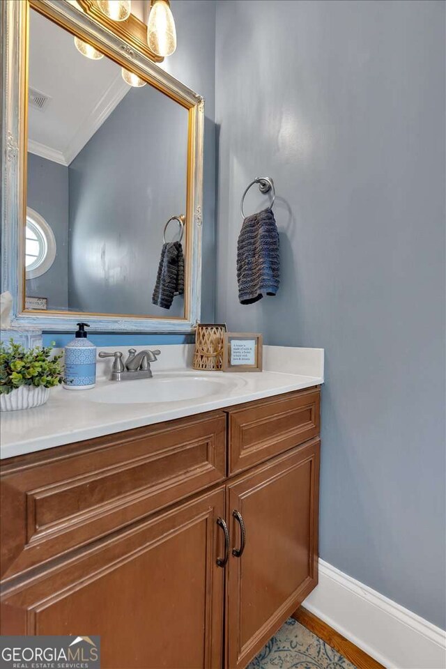 16 Quarter Horse Dr NW, Rome, GA 30165 - bathroom featuring ornamental molding, visible vents, and vanity