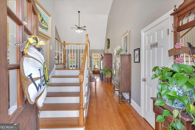 16 Quarter Horse Dr NW, Rome, GA 30165 - entryway featuring high vaulted ceiling, a ceiling fan, wood finished floors, stairs, and baseboards