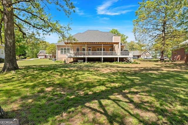 16 Quarter Horse Dr NW, Rome, GA 30165 - rear view of house featuring a wooden deck, a chimney, and a yard