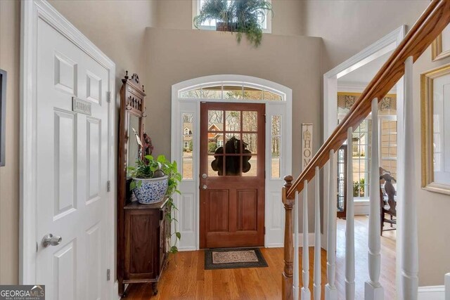 16 Quarter Horse Dr NW, Rome, GA 30165 - foyer entrance with wood finished floors, a high ceiling, and stairway