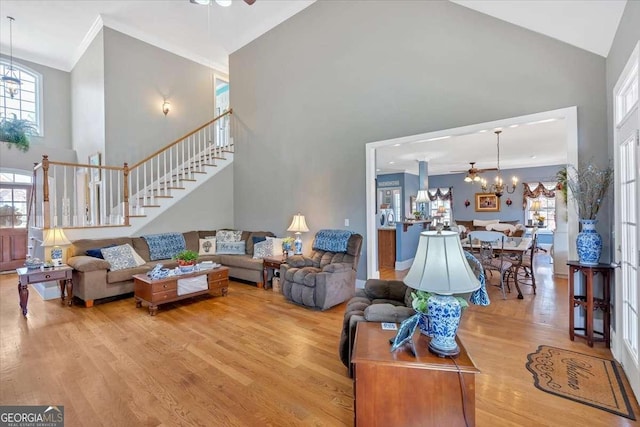 16 Quarter Horse Dr NW, Rome, GA 30165 - living area with an inviting chandelier, wood finished floors, stairway, high vaulted ceiling, and ornamental molding