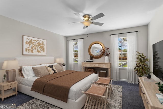 1833 Lost Mountain Rd, Powder Springs, GA 30127 - bedroom with multiple windows, carpet floors, baseboards, and a ceiling fan