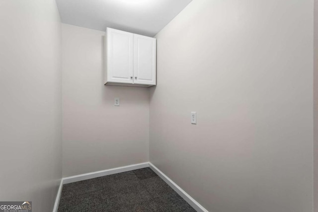 1833 Lost Mountain Rd, Powder Springs, GA 30127 - washroom with baseboards and dark carpet