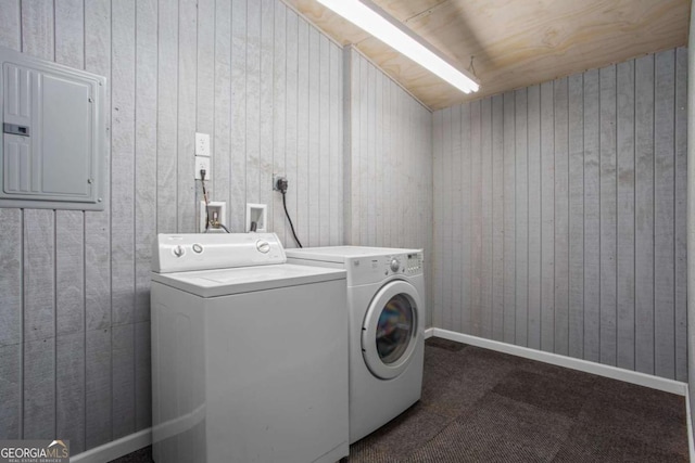 1833 Lost Mountain Rd, Powder Springs, GA 30127 - laundry area with electric panel, washing machine and dryer, wooden walls, dark colored carpet, and laundry area