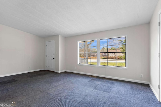 1833 Lost Mountain Rd, Powder Springs, GA 30127 - empty room with baseboards and dark carpet