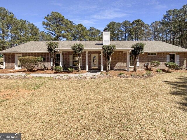105 Creekwood Ln, Fayetteville, GA 30214 - ranch-style home featuring a front yard, brick siding, and a chimney