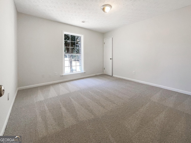 105 Creekwood Ln, Fayetteville, GA 30214 - empty room with visible vents, baseboards, carpet floors, and a textured ceiling
