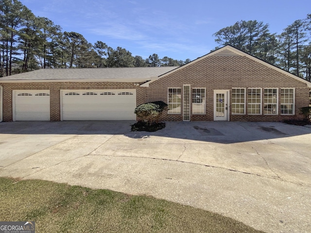 105 Creekwood Ln, Fayetteville, GA 30214 - ranch-style home featuring brick siding, driveway, and an attached garage