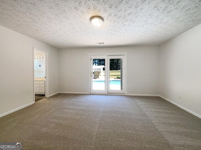 105 Creekwood Ln, Fayetteville, GA 30214 - unfurnished room with a textured ceiling, baseboards, and carpet floors