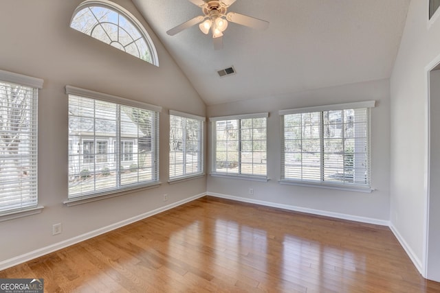 unfurnished sunroom with visible vents and a healthy amount of sunlight