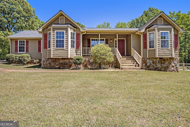ranch-style home with a porch, stone siding, and a front yard