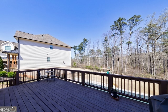 wooden deck with a playground