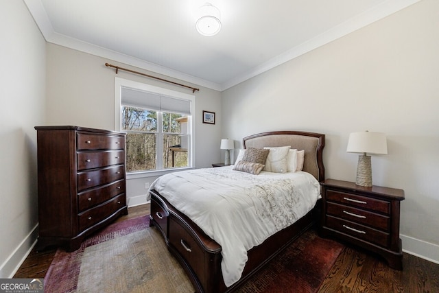 bedroom with dark wood-style flooring, baseboards, and crown molding