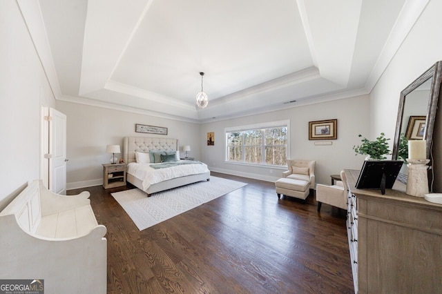 bedroom featuring a raised ceiling, crown molding, baseboards, and dark wood-style floors