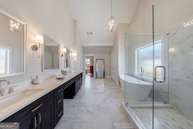 full bath with a shower stall, visible vents, marble finish floor, a freestanding bath, and double vanity