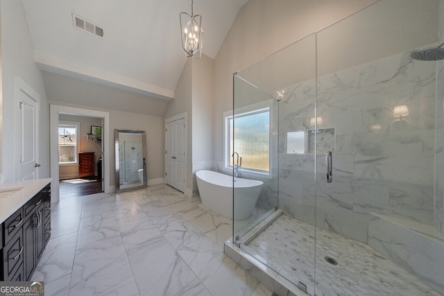 bathroom featuring visible vents, marble finish floor, vaulted ceiling, and a marble finish shower