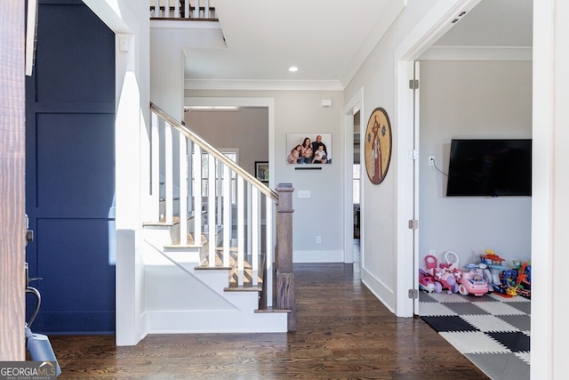 foyer entrance with baseboards, ornamental molding, recessed lighting, stairway, and wood finished floors
