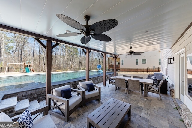 view of patio featuring an outdoor living space, fence, a playground, an outdoor pool, and outdoor dining space
