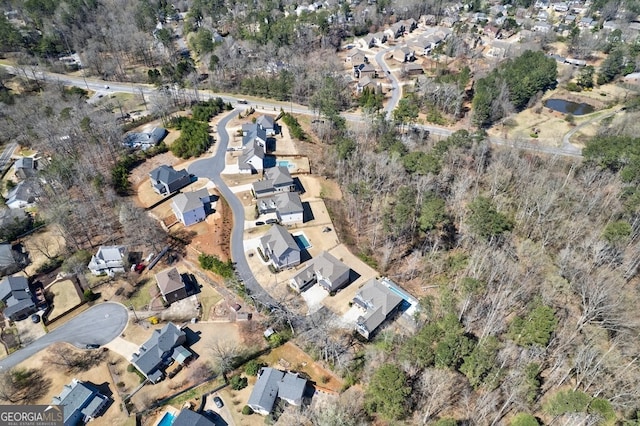 birds eye view of property with a residential view