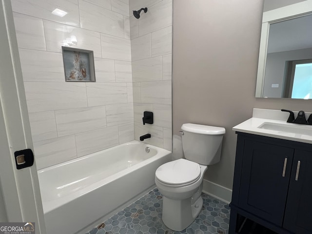 bathroom featuring shower / bath combination, baseboards, vanity, and toilet