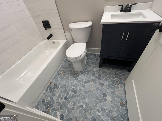 full bath featuring vanity and toilet