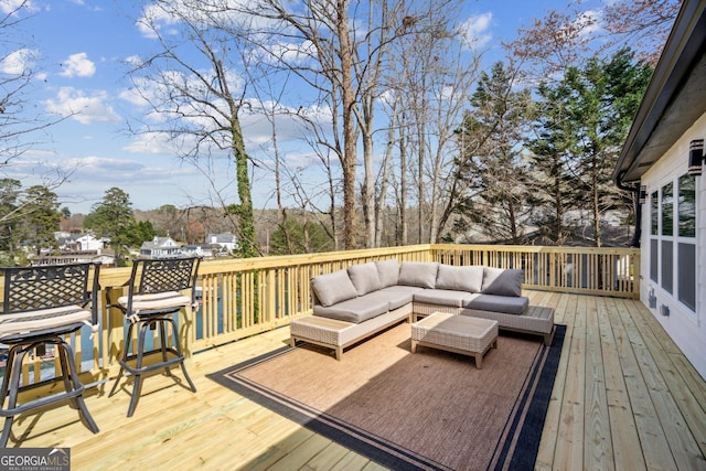 7410 Fields Dr, Cumming, GA 30041 - wooden deck featuring an outdoor living space