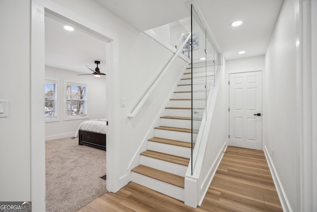 7410 Fields Dr, Cumming, GA 30041 - stairway featuring recessed lighting, baseboards, a ceiling fan, and wood finished floors