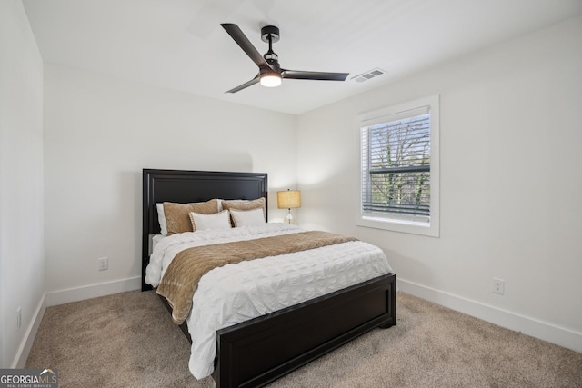 7410 Fields Dr, Cumming, GA 30041 - bedroom with visible vents, light carpet, baseboards, and ceiling fan