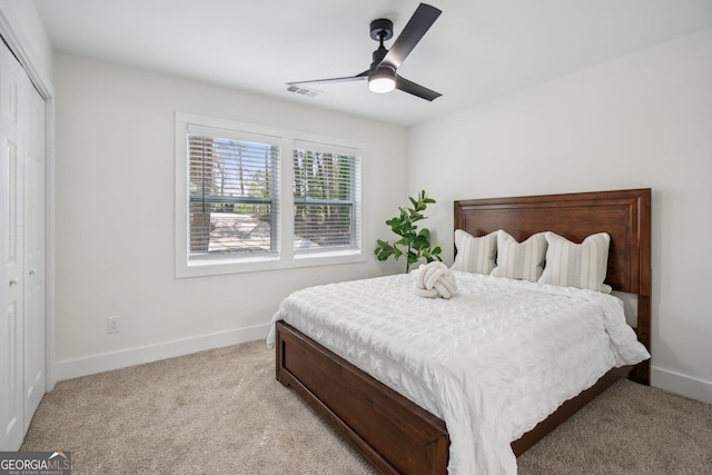 7410 Fields Dr, Cumming, GA 30041 - bedroom with a closet, visible vents, light colored carpet, and baseboards