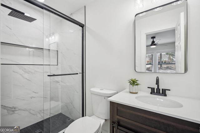 7410 Fields Dr, Cumming, GA 30041 - bathroom with a marble finish shower, toilet, vanity, and ceiling fan