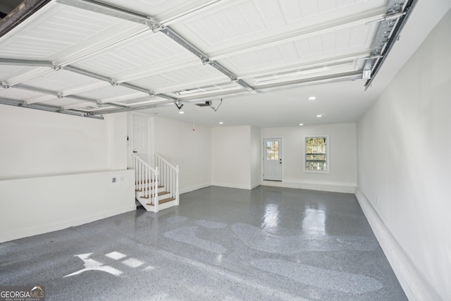 7410 Fields Dr, Cumming, GA 30041 - garage featuring a garage door opener, recessed lighting, and baseboards