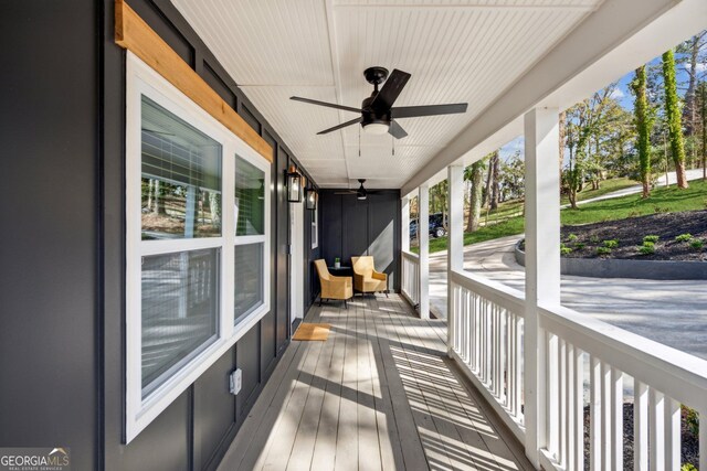 7410 Fields Dr, Cumming, GA 30041 - wooden deck featuring covered porch and ceiling fan