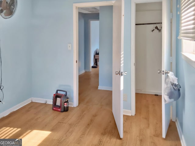 interior space featuring a closet and light wood-type flooring
