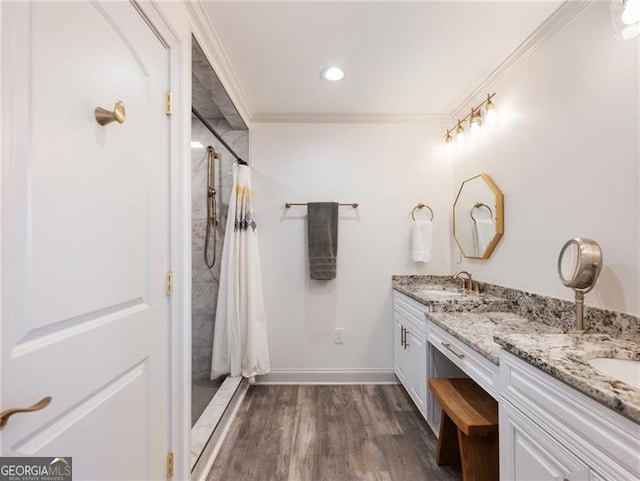 6041 Blackberry Ln, Buford, GA 30518 - bathroom featuring double vanity, ornamental molding, curtained shower, wood finished floors, and baseboards