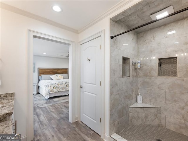 6041 Blackberry Ln, Buford, GA 30518 - ensuite bathroom with a tile shower, wood finished floors, and ornamental molding