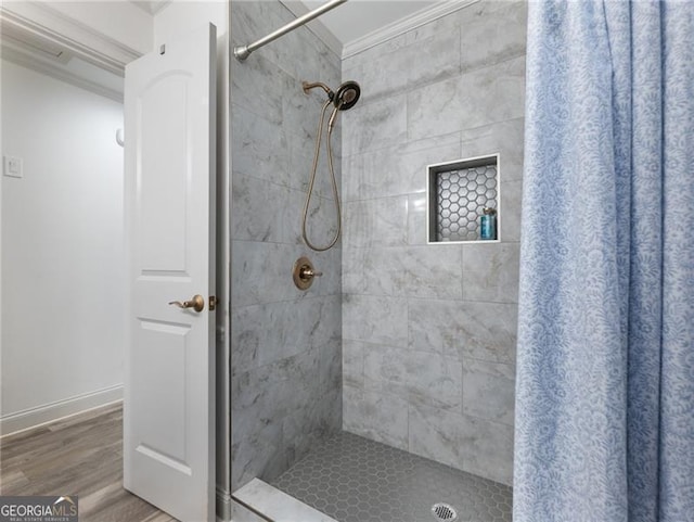 6041 Blackberry Ln, Buford, GA 30518 - bathroom featuring a tile shower, wood finished floors, and ornamental molding