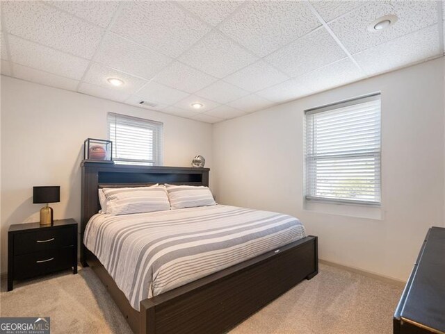 6041 Blackberry Ln, Buford, GA 30518 - bedroom featuring light colored carpet, a drop ceiling, and baseboards