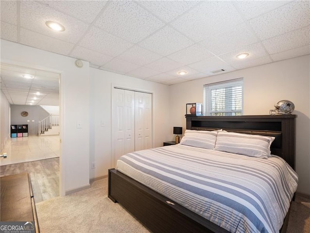6041 Blackberry Ln, Buford, GA 30518 - bedroom with a paneled ceiling, a closet, baseboards, light colored carpet, and recessed lighting