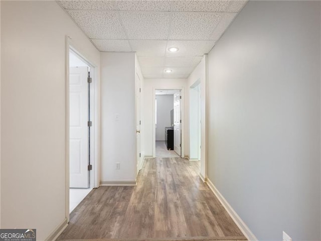 6041 Blackberry Ln, Buford, GA 30518 - corridor featuring a paneled ceiling, wood finished floors, baseboards, and recessed lighting