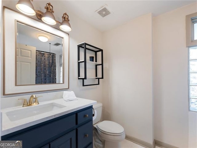 6041 Blackberry Ln, Buford, GA 30518 - full bathroom with toilet, vanity, tile patterned flooring, and curtained shower
