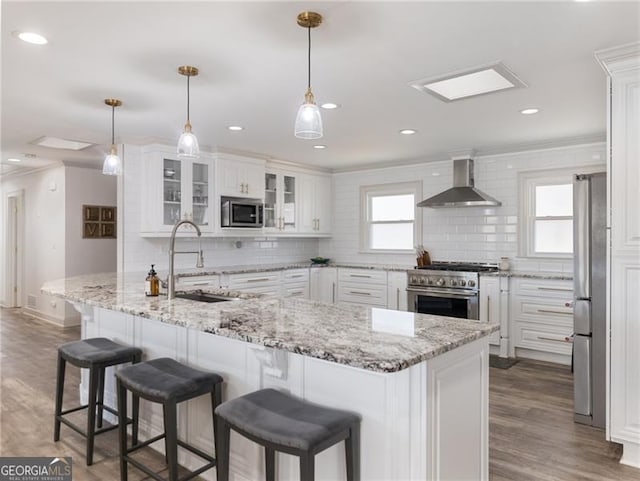6041 Blackberry Ln, Buford, GA 30518 - kitchen with wall chimney range hood, stainless steel appliances, a sink, ornamental molding, and decorative backsplash