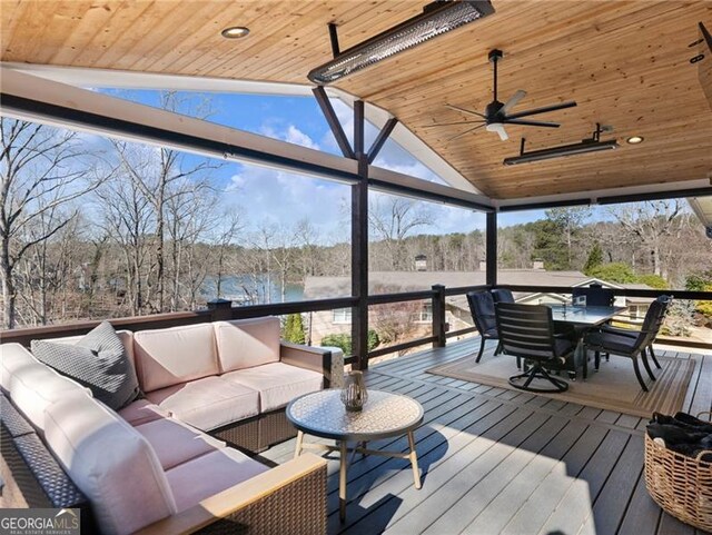 6041 Blackberry Ln, Buford, GA 30518 - wooden deck with an outdoor living space, a ceiling fan, outdoor dining space, and a water view