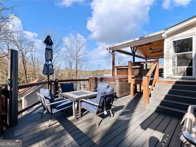 6041 Blackberry Ln, Buford, GA 30518 - wooden deck featuring a hot tub, ceiling fan, and outdoor dining space