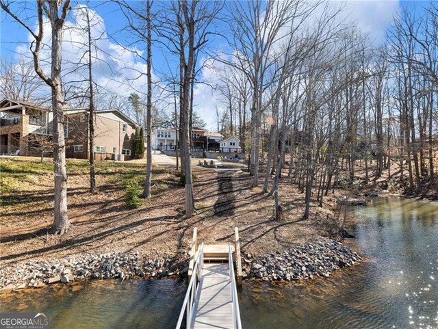 6041 Blackberry Ln, Buford, GA 30518 - dock featuring a water view