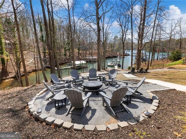 6041 Blackberry Ln, Buford, GA 30518 - view of patio / terrace with a fire pit and a water view