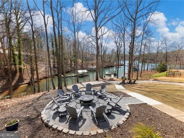 6041 Blackberry Ln, Buford, GA 30518 - view of patio featuring a fire pit and a water view