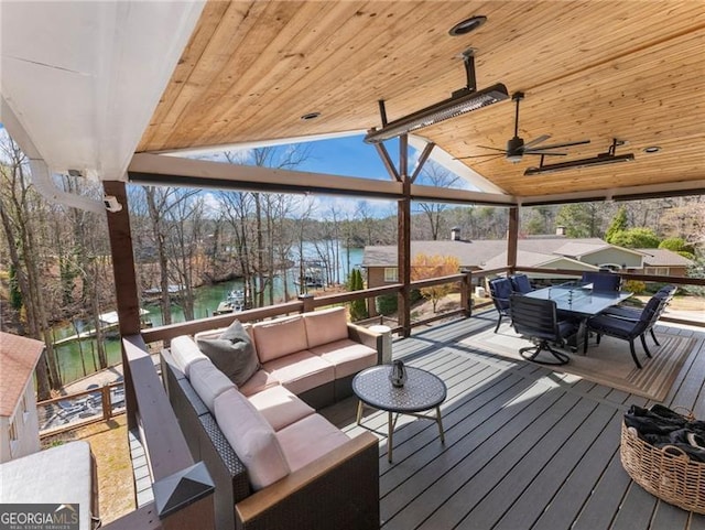 6041 Blackberry Ln, Buford, GA 30518 - wooden deck with a water view, an outdoor living space, outdoor dining space, and ceiling fan